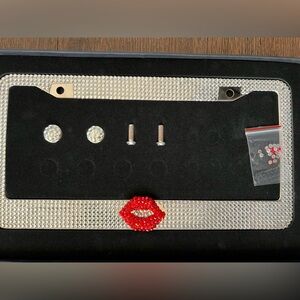 New in box Carfond bling rhinestone license plate frame.  Red lips.